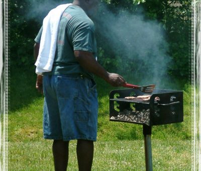 Mr Mason grilling burgers for Anchor's Memorial day