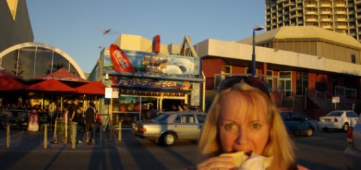 Barb at the beach eating a Peters by the Sea hamburger