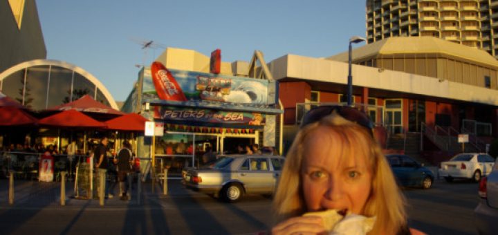 Barb at the beach eating a Peters by the Sea hamburger