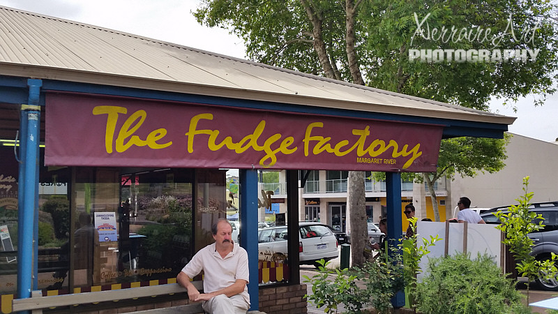 I tried a long time to get a photo of the place without a certain person. I couldn't make the shot work without him. So as obvious as I was that I was taking a photo, he wouldn't budge. So, this is the front of the Fudge Factory plus a perfect stranger. :)