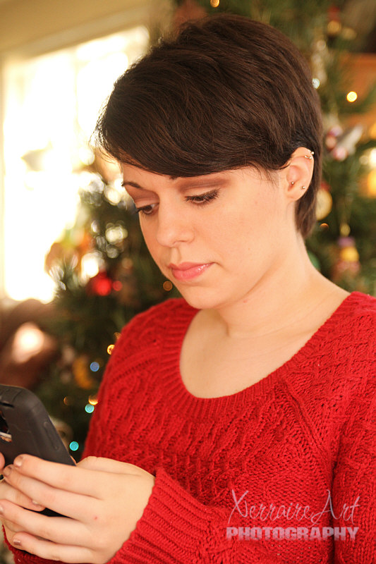 Now I practice with my new camera (a present from John) and get Laura with her phone.