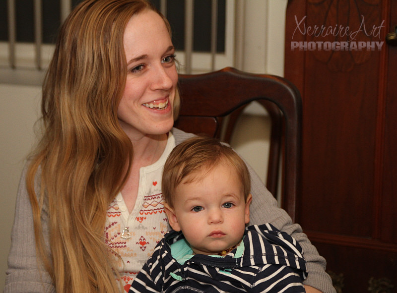Heather holds a pretty sick little Ezra.