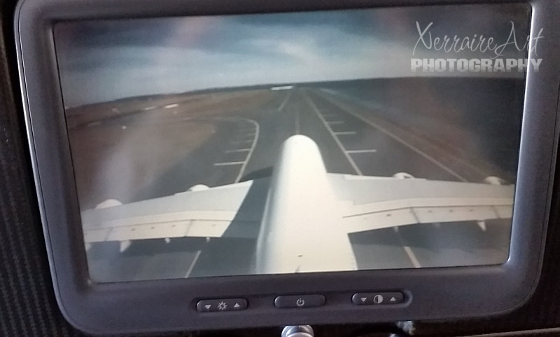Having boarded my long flight to Dallas, and not too talkative as I am surely visibly sad about leaving John, my seat mate is excited to point out that the plane has a webcam to see what is going on outside the plane.