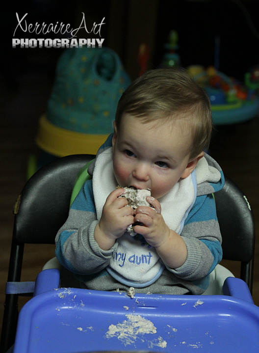 Not too used to regular food, Ezra soon found out the object of the first birthday was to make a mess with the cake.