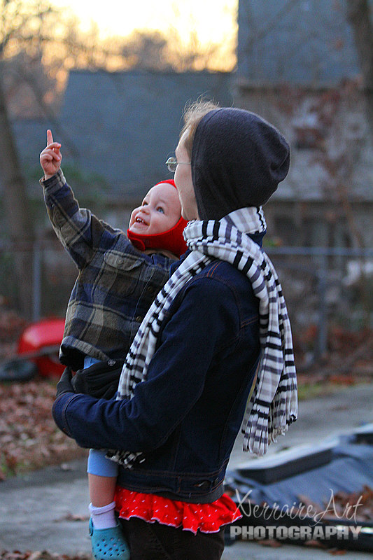 Miranda bundled up Ezra to join in the fun. He spots an airplane overhead.