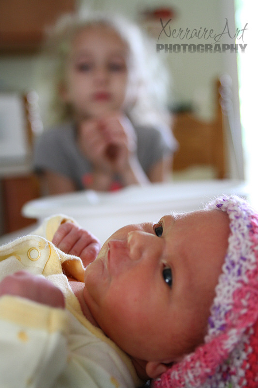Mireia seems to relax and enjoy as Rubi looks on.
