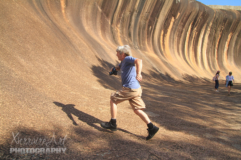 John running up wave rock