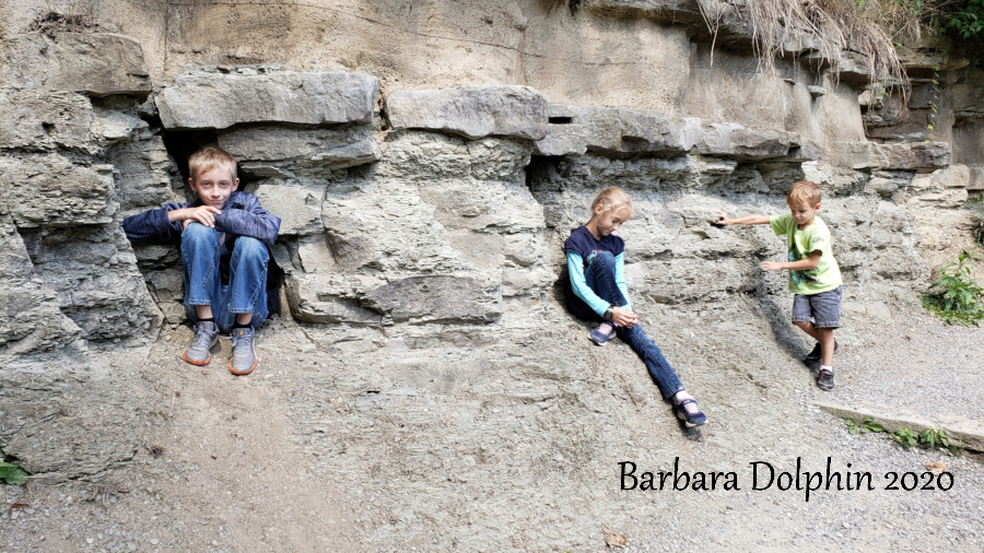 playing on the rock wall