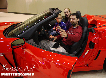 Enric, Miranda, and Silas in the Corvette