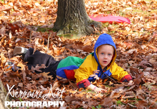 Silas falling in the leaves.