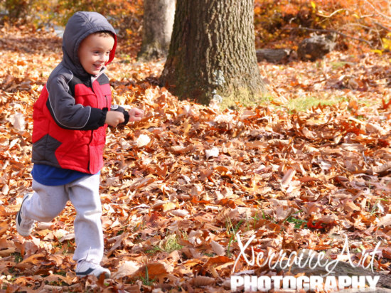 Cameron running in the leaves.