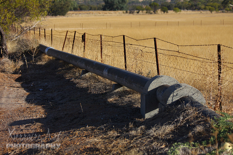 Each pipe consists of two plates curved in semi-circles and held together on each side along their complete length by the locking-bar. This was a long double-grooved bar into which the burred edges of the plates were fitted and held tightly in position by clamps, while the locking-bars were closed by a machine which exerted terrific pressure. Before each pipe left the factory it was subjected to pressure test of 400 psi, and so effective was the locking-bar that very few faults were revealed.