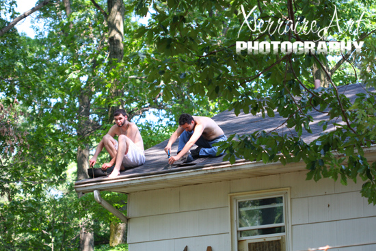 Miquel and Enric checking the gutters and roof on the house. 