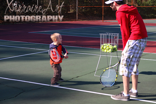 Learning how to stand and hold the racket.