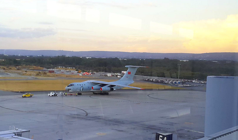 We had time to look around before we had to physically part, and John spotted this Chinese plane. He figured it was from the search team for that missing Malaysian flight MH370.