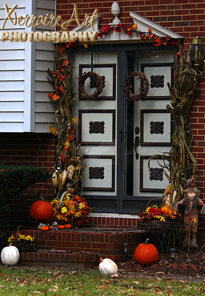 Doorsteps adorned in Indian corn and pumpkins.