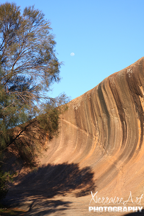 An early moon over Wave Rock
