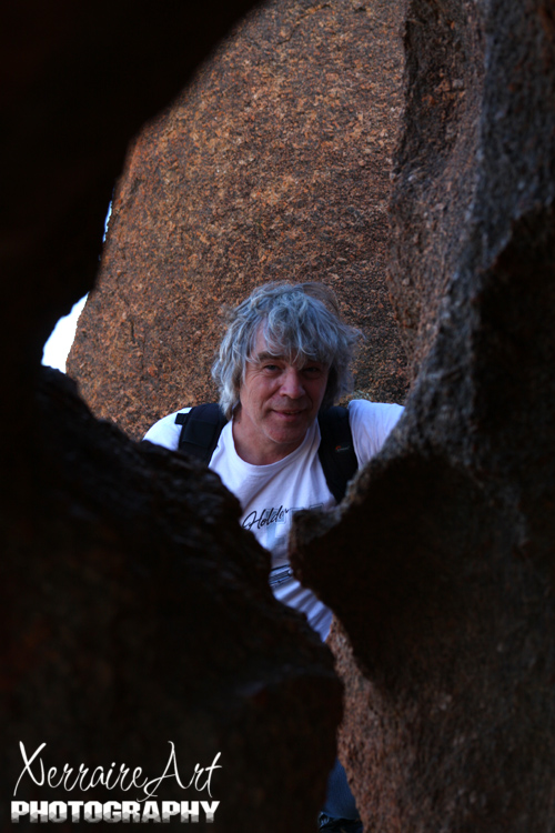 Playing peek-a-boo with John atop Wave Rock amongst the rocks.