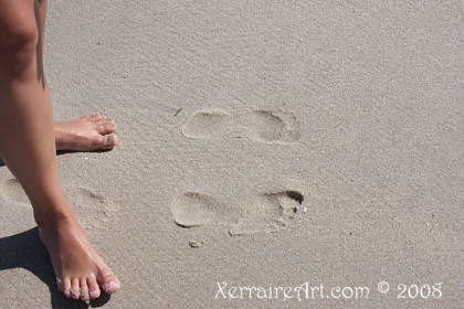 Laura's foot in the sand