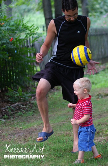 Enric playing soccer with Silas
