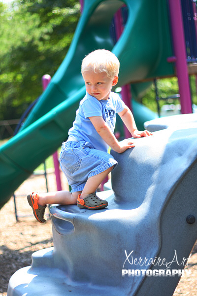 Silas climbing on the playground