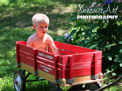 Silas in the red wagon